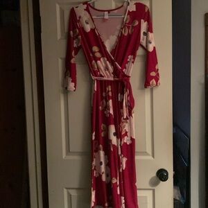 NWOT floral cropped leg jumpsuit with wrap style top and tie belt